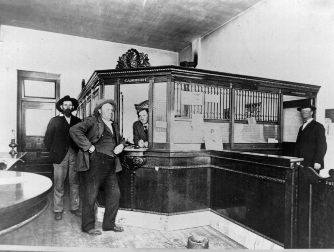 1910 image of 4 men at Ozark Bank