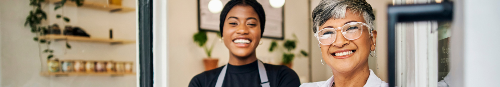 two women smiling with their small business