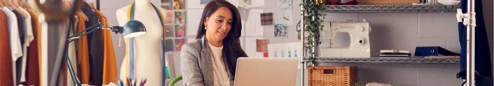 a fashion designer working on her laptop