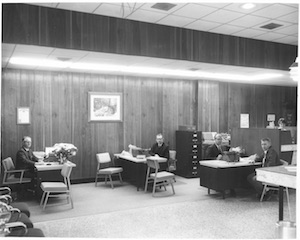 Ozark Bank bankers working at their desks in the late 1960s or 70s